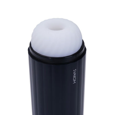 a black trash can with a white lid